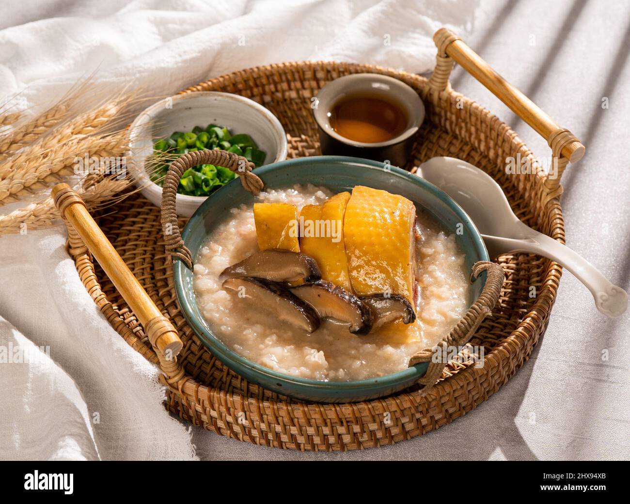 Congee chicken with shiitake mushroom with spring onion in a dish side