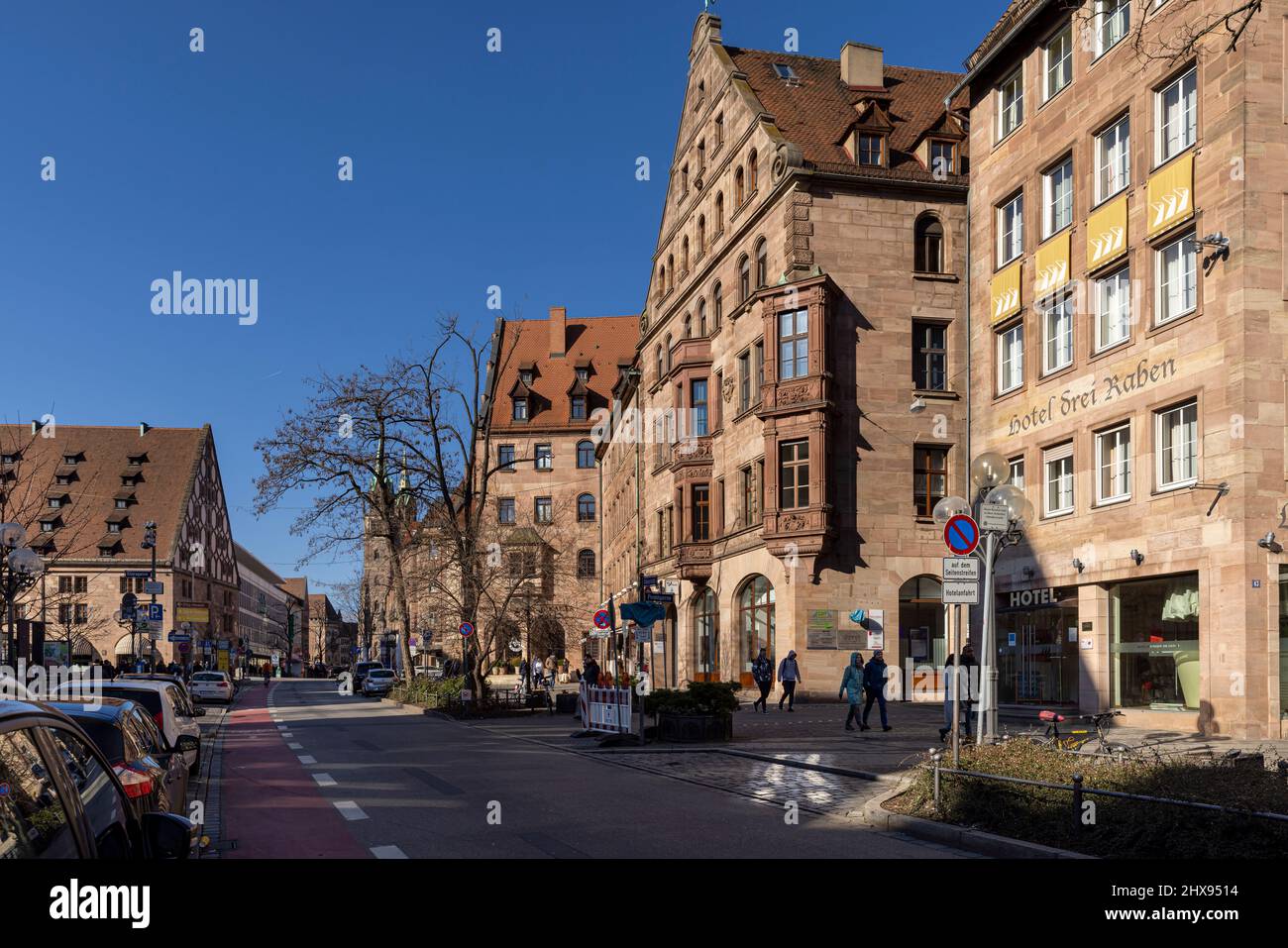 People walking on narrow alleys between historical buildings in Nuremberg old town Stock Photo