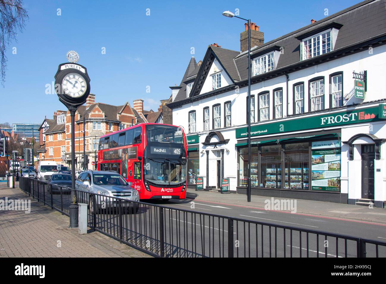 Double decker bus red millennium clock traffic junction shops sh hires