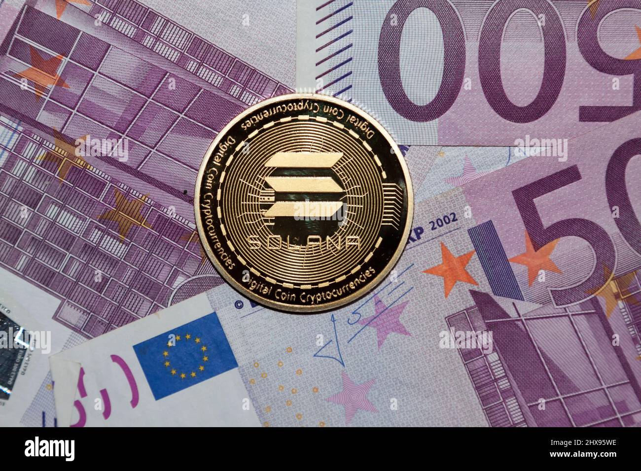 Coin Solana and 500 Euro bank notes Stock Photo - Alamy