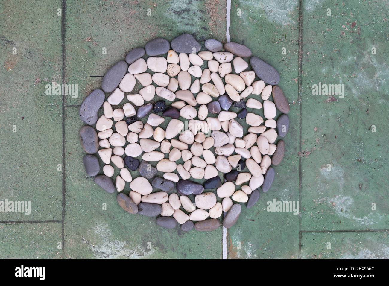 Smiley face made of stones Stock Photo