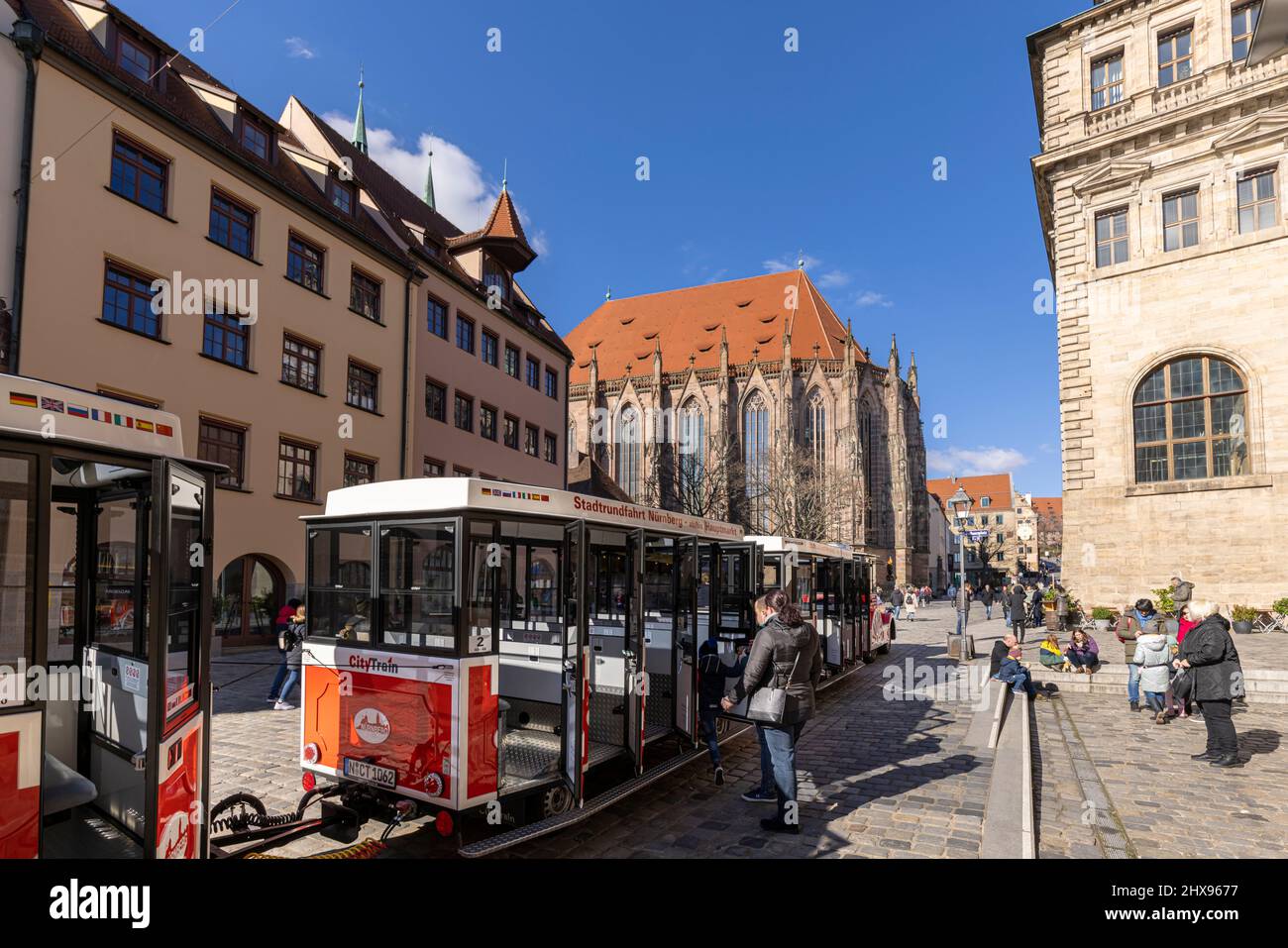People walking on narrow alleys between historical buildings in Nuremberg old town Stock Photo