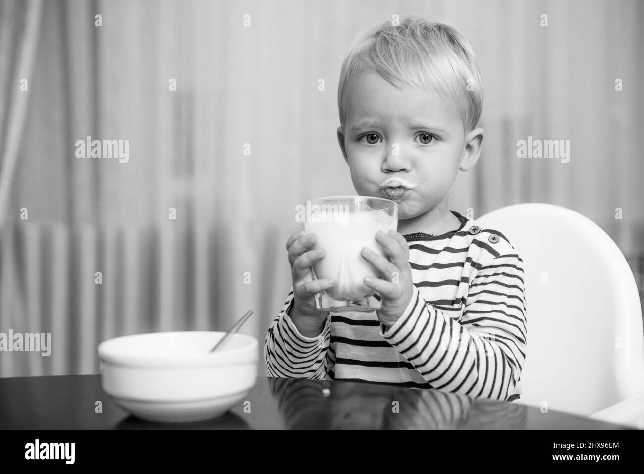 Eat healthy. Toddler having snack. Healthy nutrition. Drink milk. Child