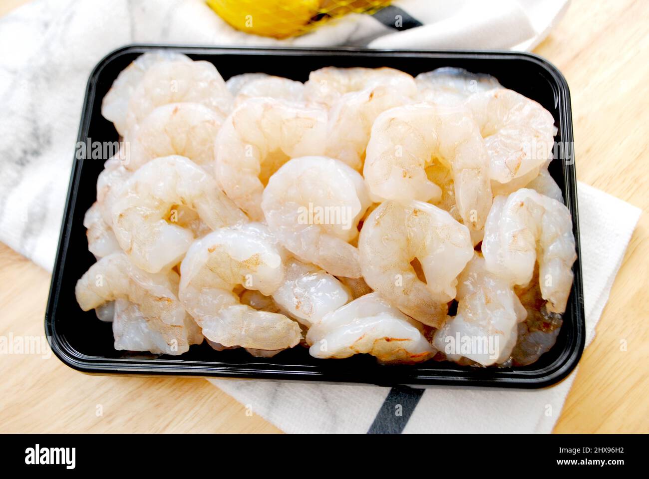 Large Raw Jumbo Shrimp in a Black Container Stock Photo