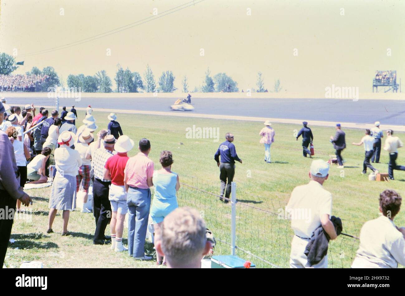 A race car crast seen at the 1963 Indianapolis 500 race from the race track infield ca. 1963 Stock Photo