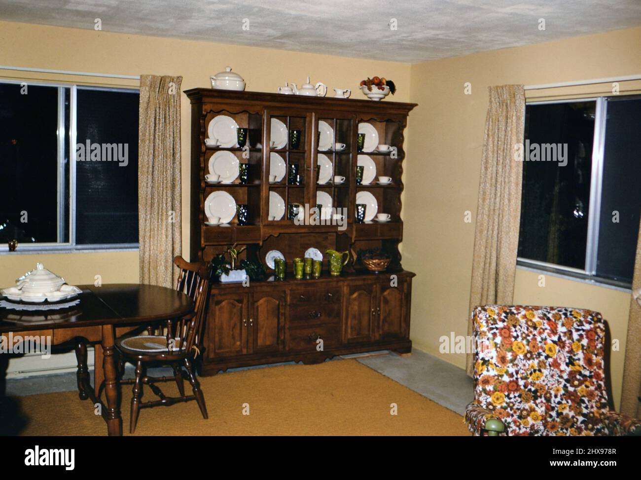 Interior of an early 1970s middle class home, this dining room features a  china cabinet ca. 1970 Stock Photo - Alamy