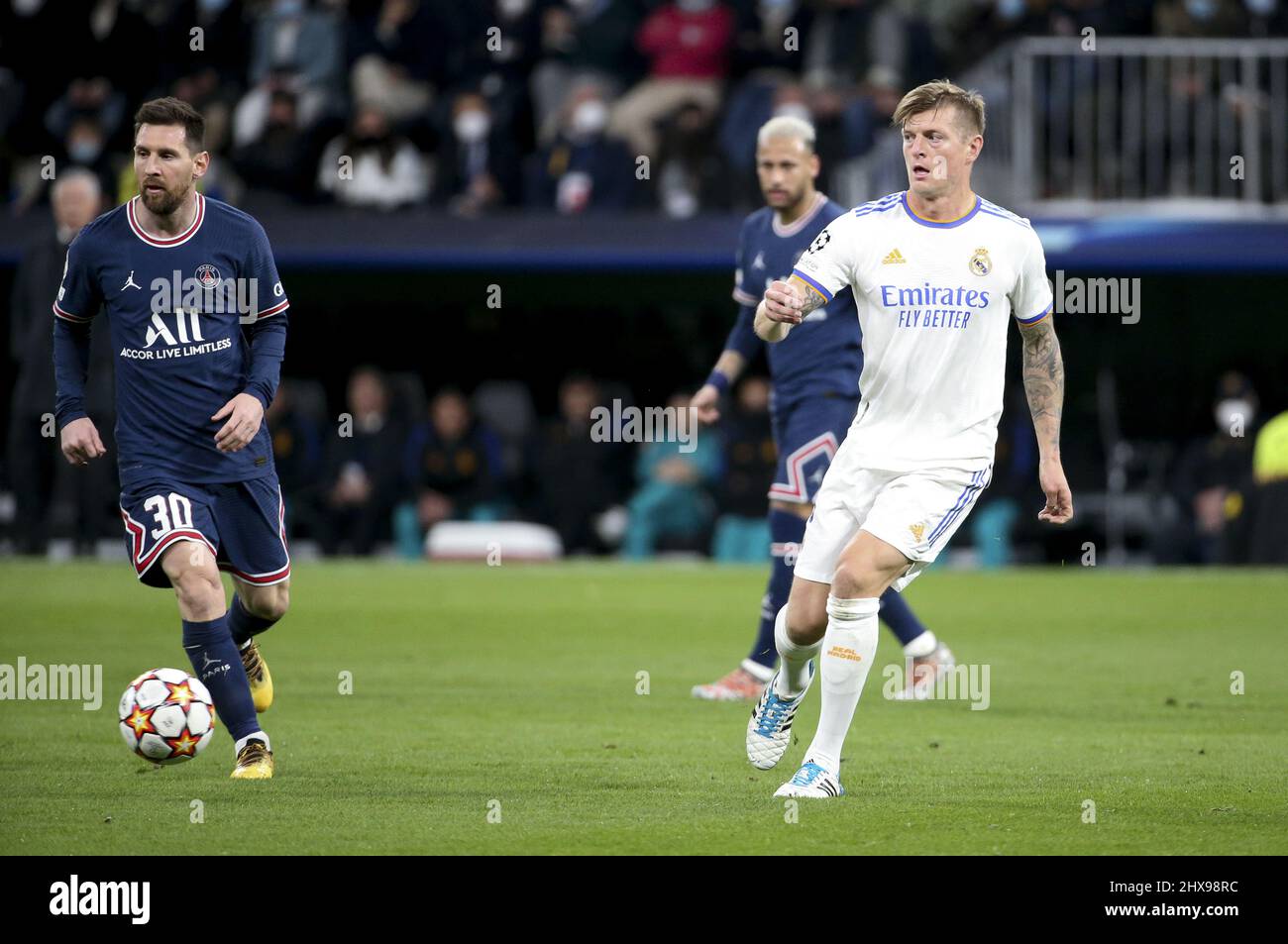 Toni Kroos of Real Madrid, Lionel Messi of PSG (left) during the UEFA Champions League, Round of 16, 2nd leg football match between Real Madrid and Paris Saint-Germain (PSG) on March 9, 2022 at Santiago Bernabeu stadium in Madrid, Spain - Photo: Jean Catuffe/DPPI/LiveMedia Stock Photo