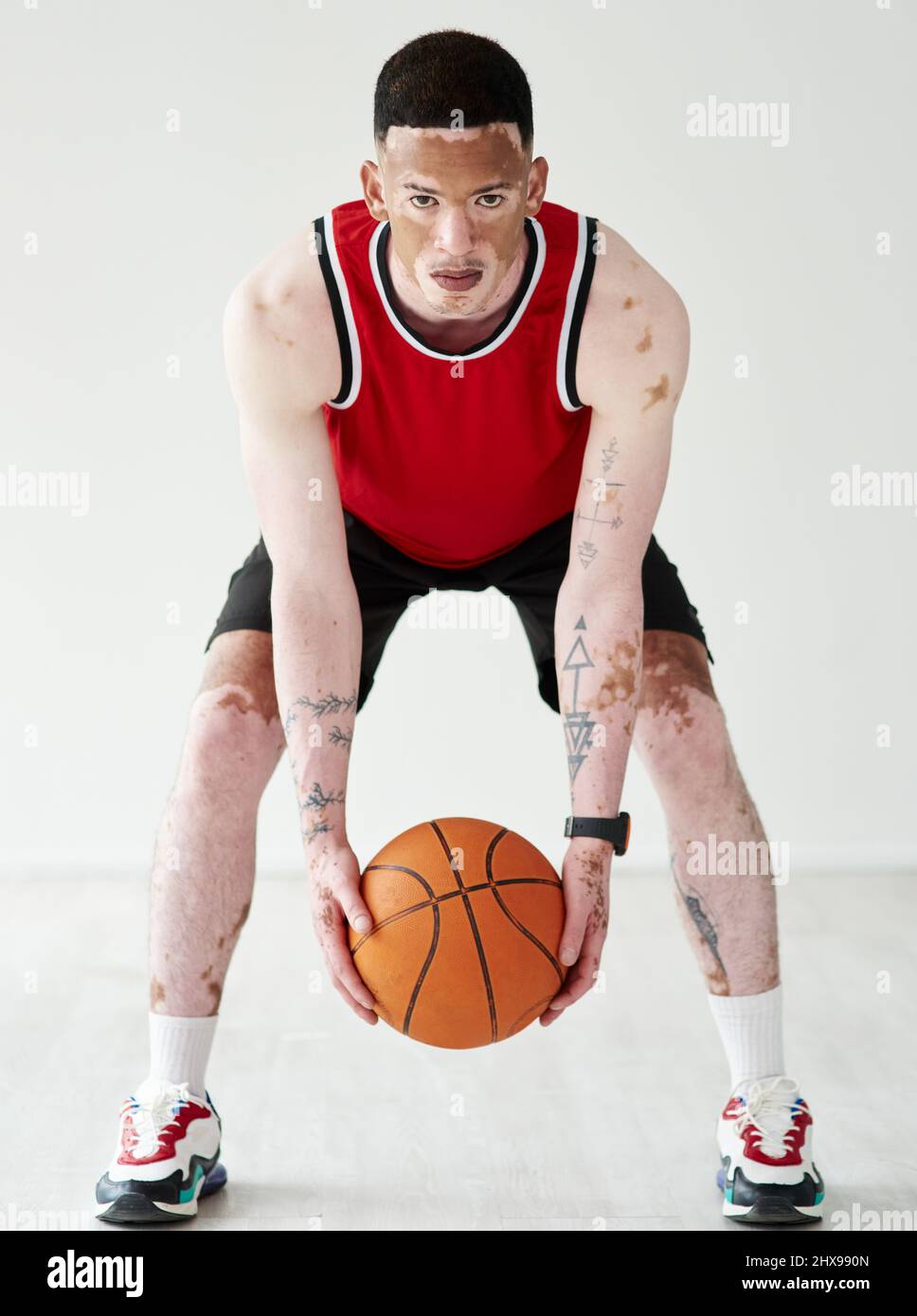 Wanna ball. Full length portrait of a handsome young male basketball player posing in studio. Stock Photo
