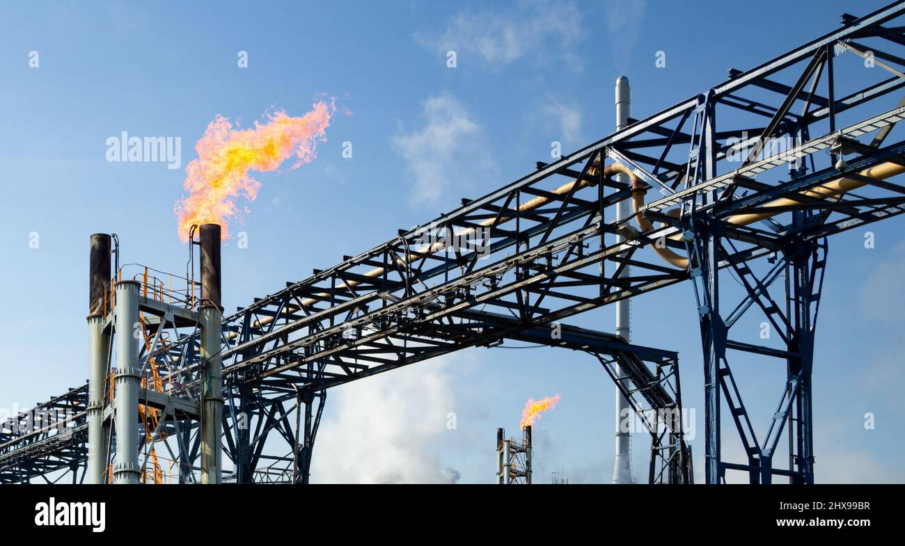 Pipeline with gas flare stacks. Concept North Sea gas, energy crisis