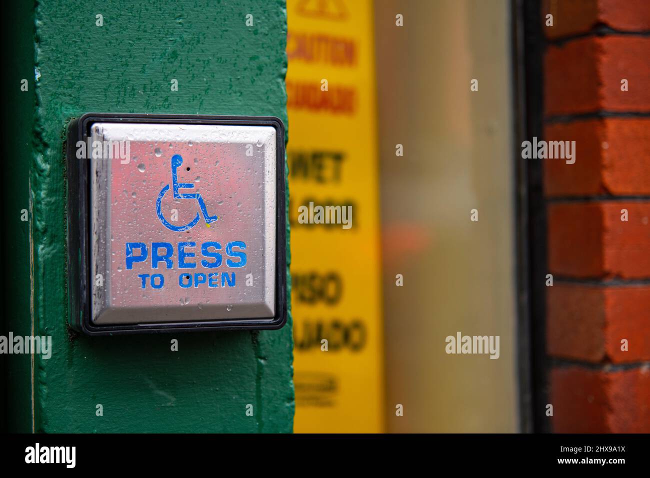 Push to open button,push button for persons with disabilities Stock Photo