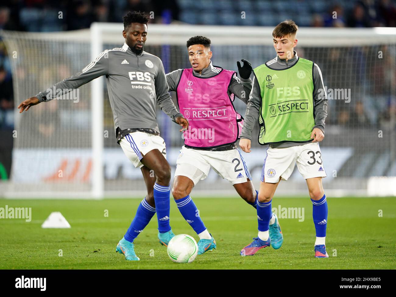 Leicester City's Wilfred Ndidi (left), James Justin (centre) and Luke Thomas warming up before the UEFA Europa Conference League round of sixteen first leg match at the King Power Stadium, Leicester. Picture date: Thursday March 10, 2022. Stock Photo