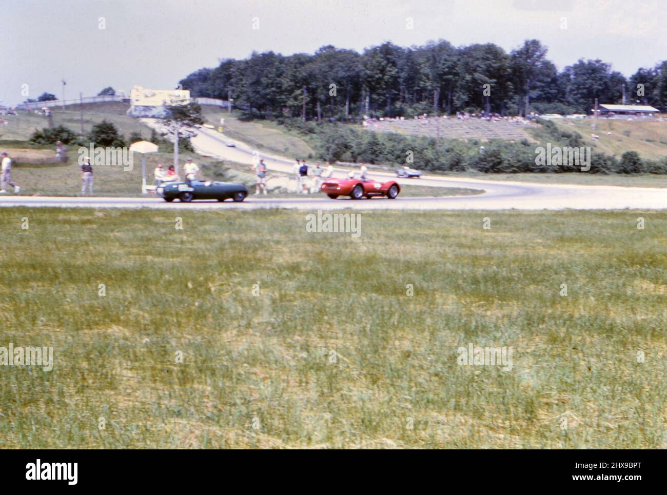 1960s Auto Racing: Race cars taking a turn on an unidentified race track oca. 1963 Stock Photo