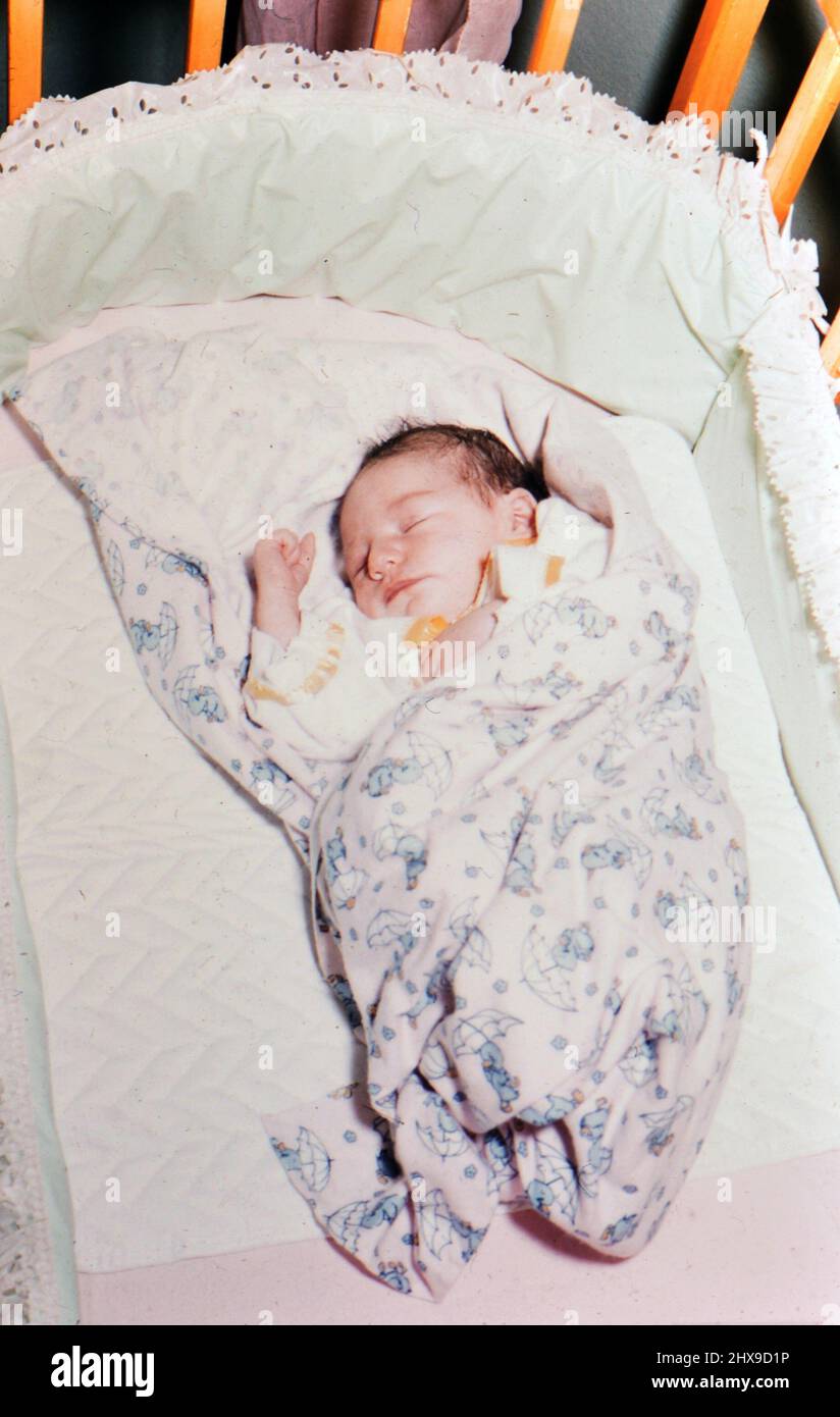 Baby sleeping in her crib ca. 19551959 Stock Photo Alamy