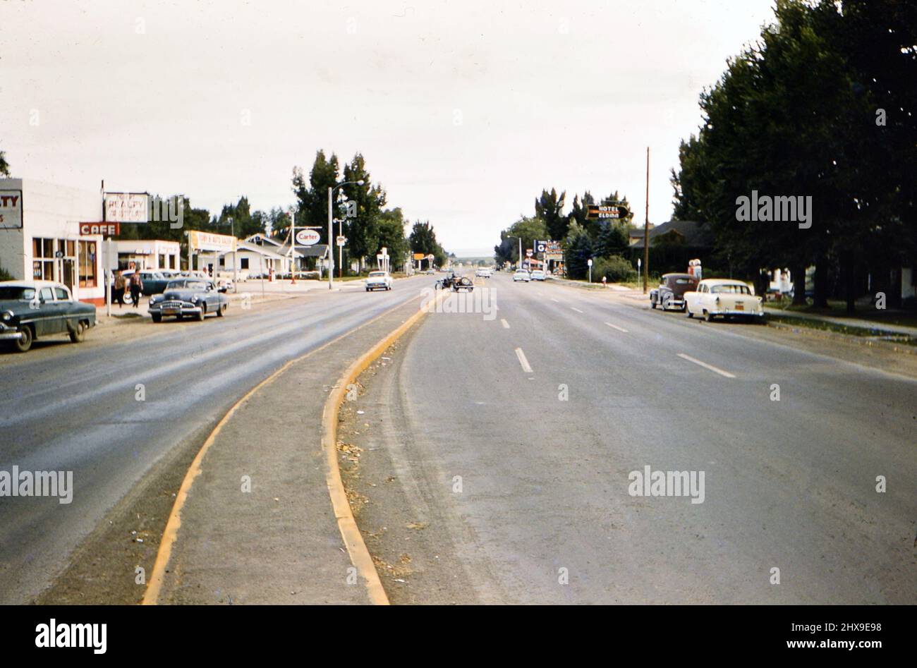 Street scene in small American town, an Esso "Carter" gas station on