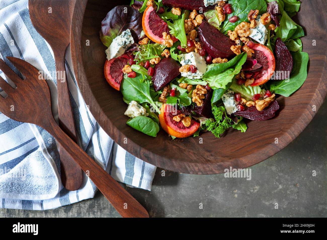 Mixed Green Salad in Wood Bowl Stock Photo