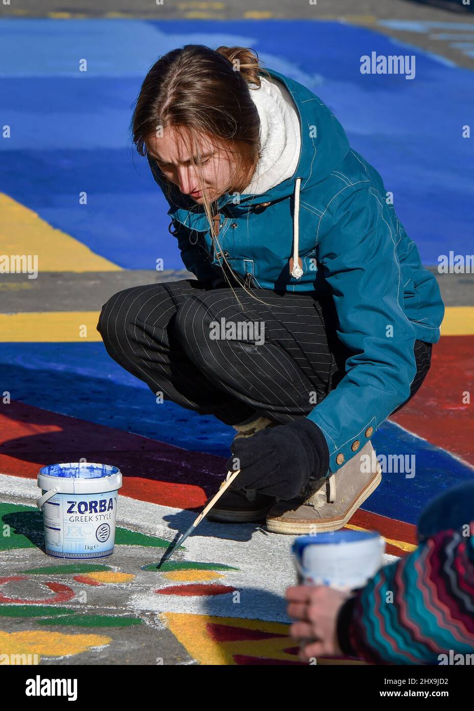 Ostrava, Czech Republic. 10th Mar, 2022. Dozens of people paint Ukrainian and Tibetan flag in the occasion of the annual Festival Flag for Tibet event in support of human rights observance in Tibet in Ostrava, Czech Republic, March 10, 2022. Credit: Jaroslav Ozana/CTK Photo/Alamy Live News Stock Photo