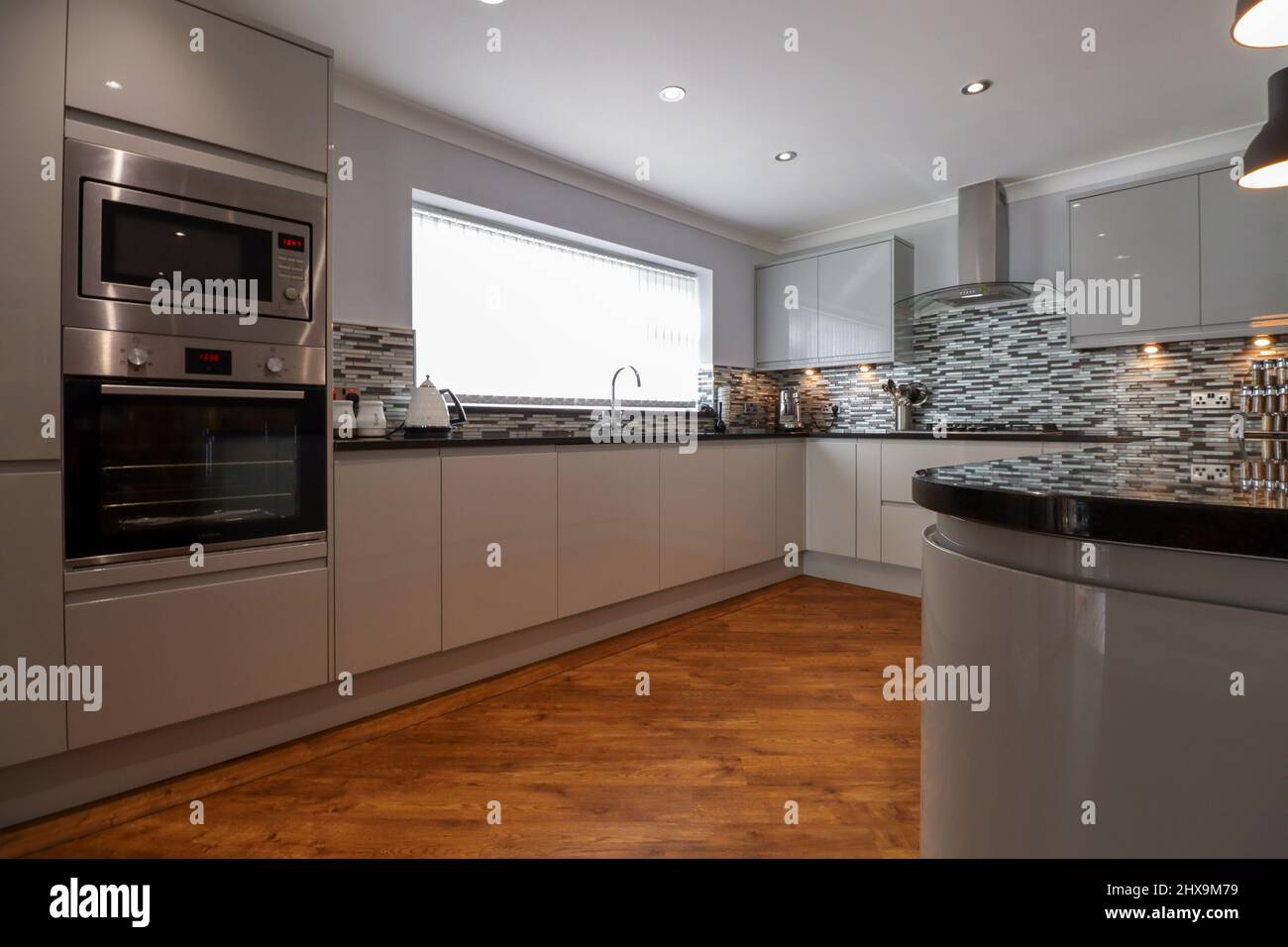 Ultra modern grey high gloss kitchen in contemporary home Stock Photo Alamy