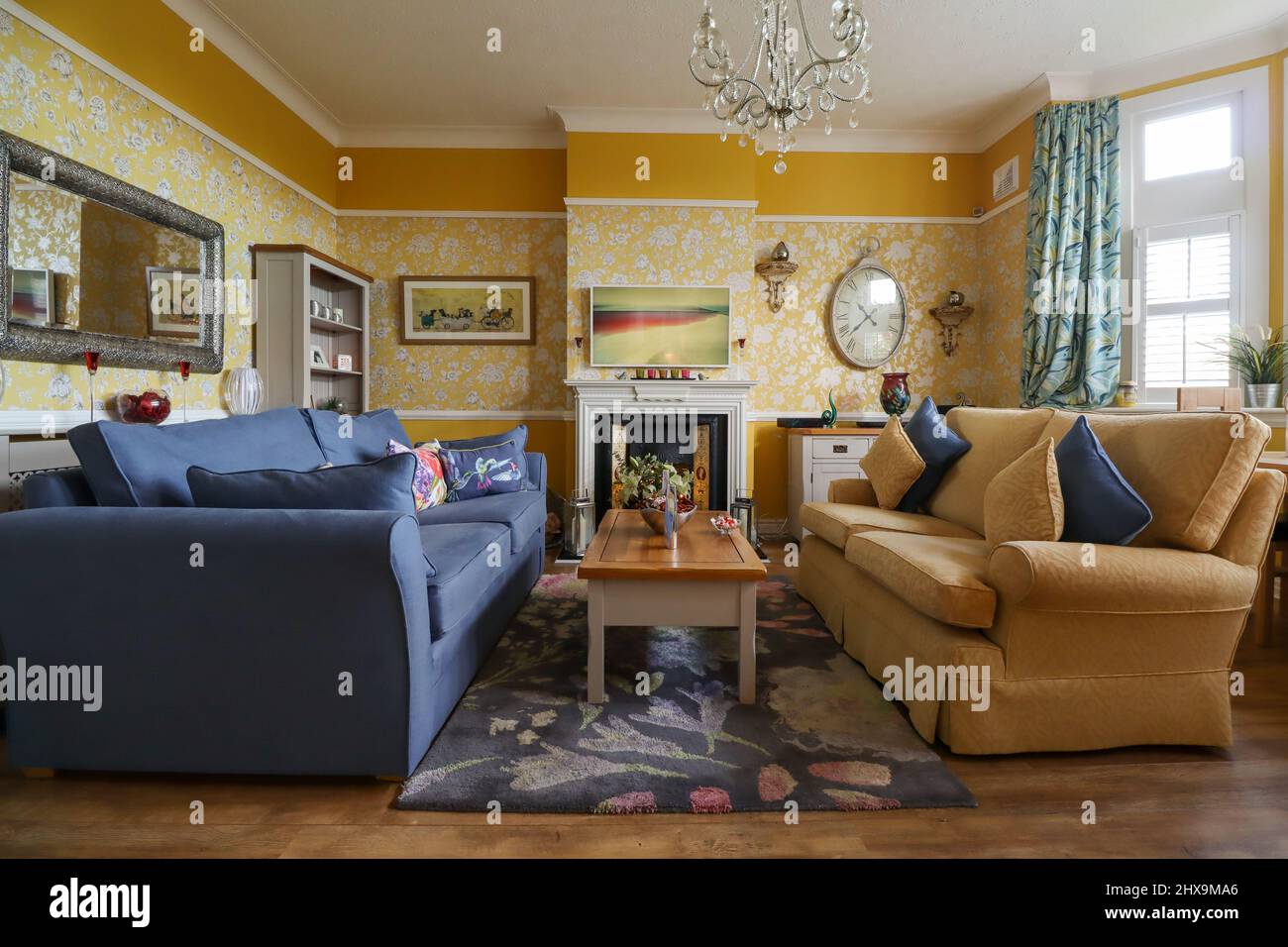 A classically decorated navy blue and yellow ochre living room / lounge Stock Photo