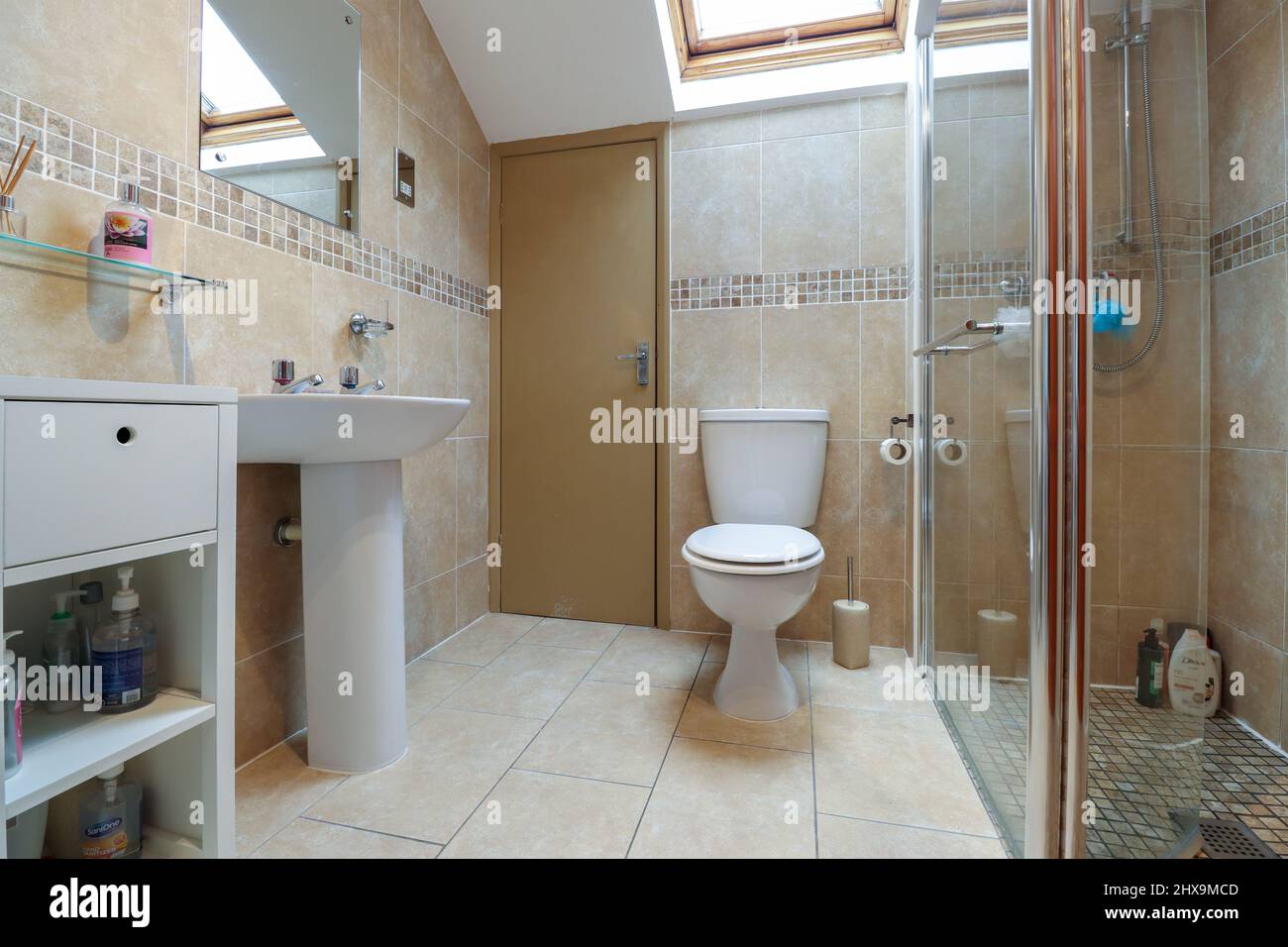 Bathroom in an older house, with walk in shower cubicle Stock Photo