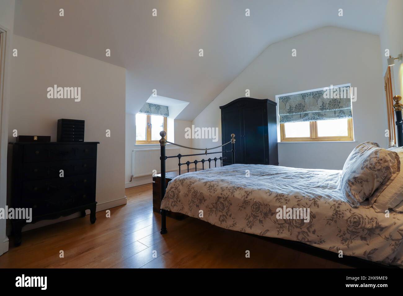 Modern large bedroom with black furniture Stock Photo Alamy