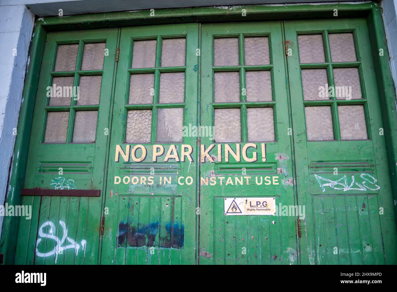 Old fashioned painted garage doors with vintage style lettering