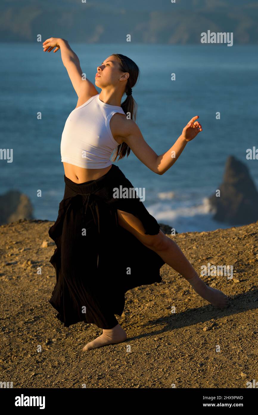 Authentic Multiracial Female Dancer on Cliff Overlooking San Francisco Bay Stock Photo