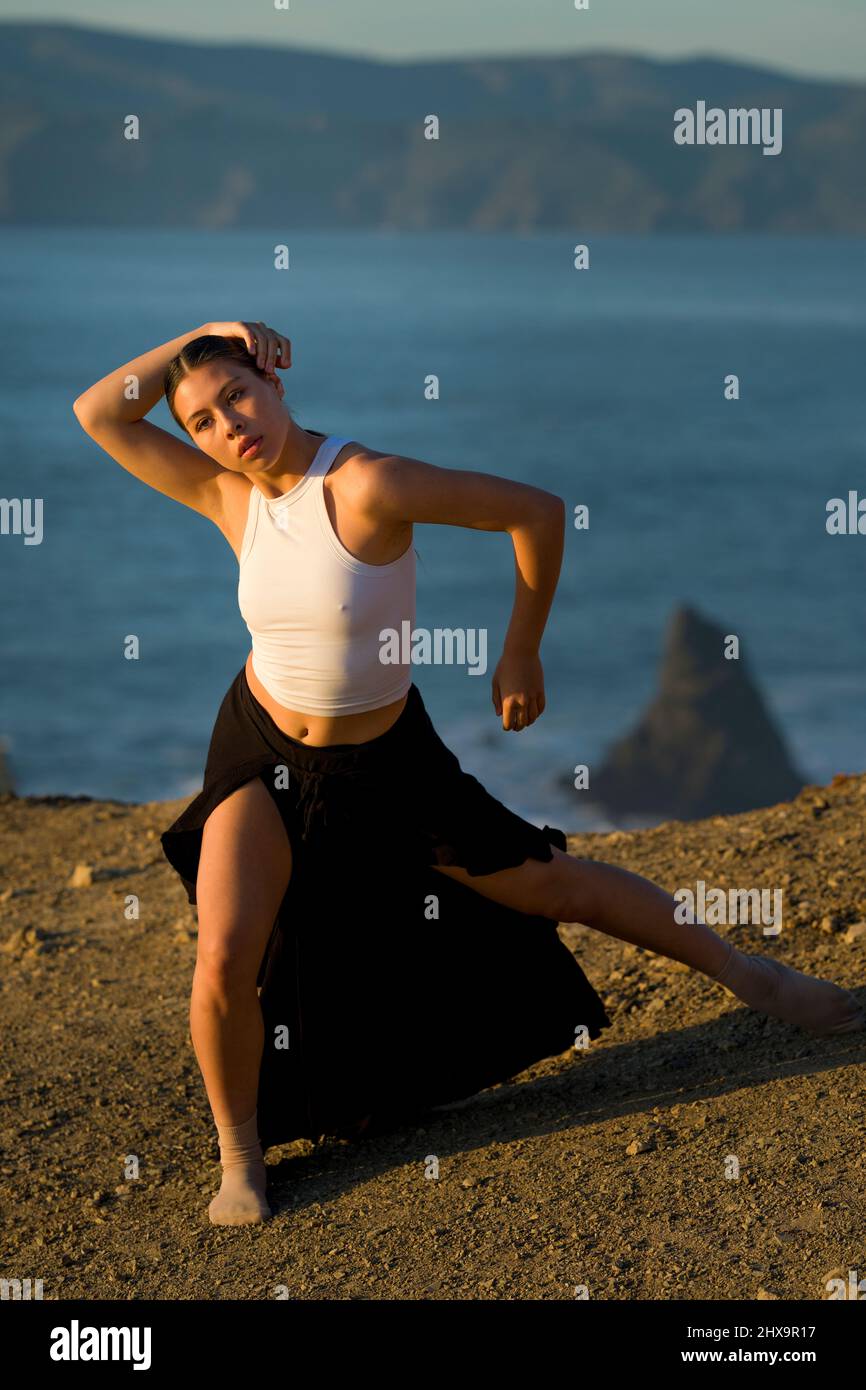 Authentic Multiracial Female Dancer on Cliff Overlooking San Francisco Bay Stock Photo