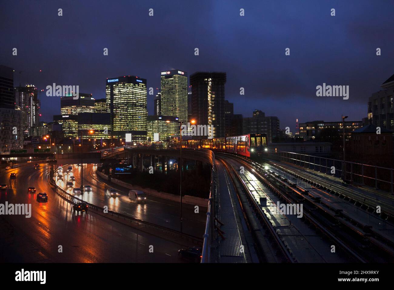 East India Docklands light railway station, DLR train heading away from the city of london Stock Photo