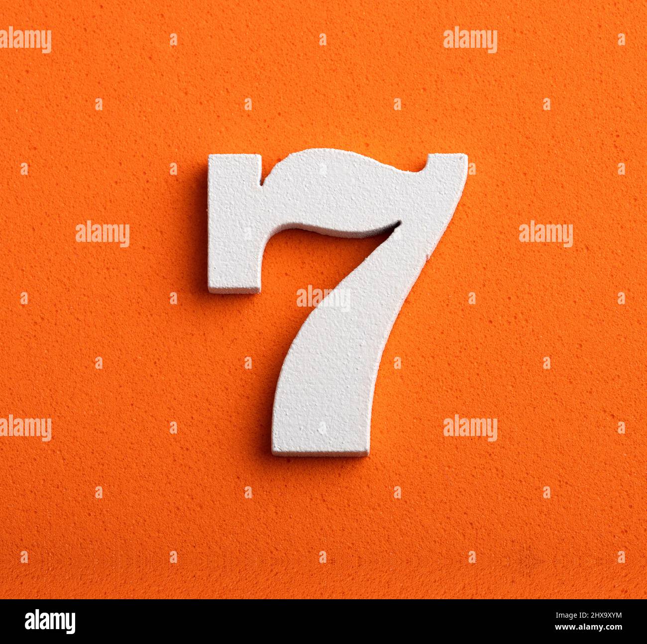 Number seven white number in wood on orange background Stock Photo Alamy Number seven white number in wood on orange background Stock Photo Alamy