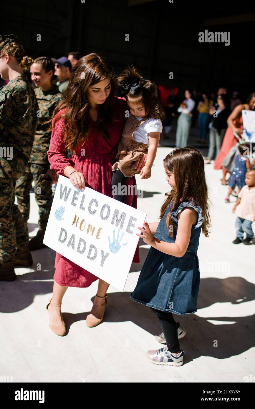 Mom & Daughters Waiting for Military Homecoming in San Diego Stock Photo
