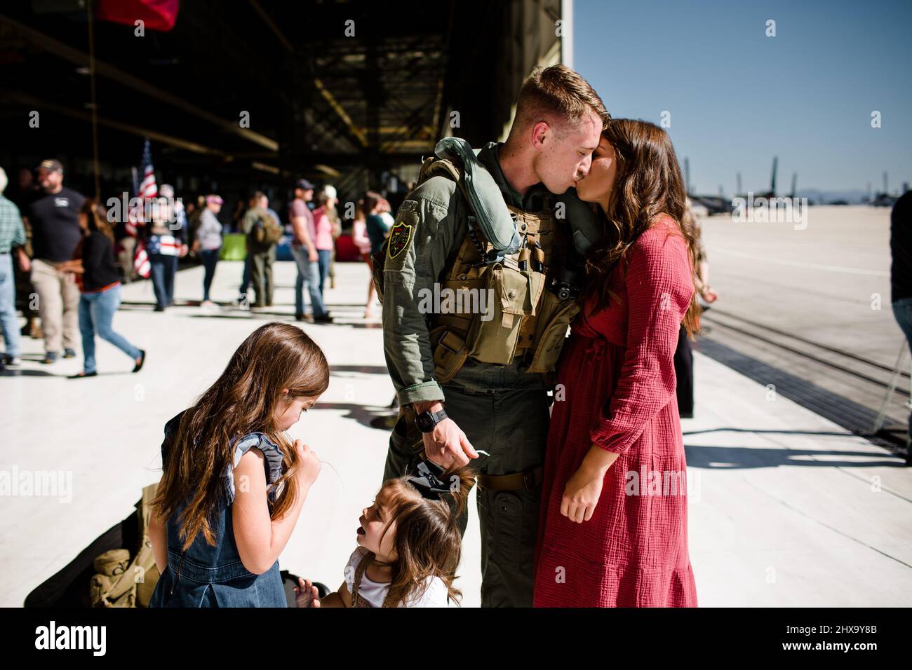 Marine Kissing Wife & Reuniting with Family in San Diego Stock Photo