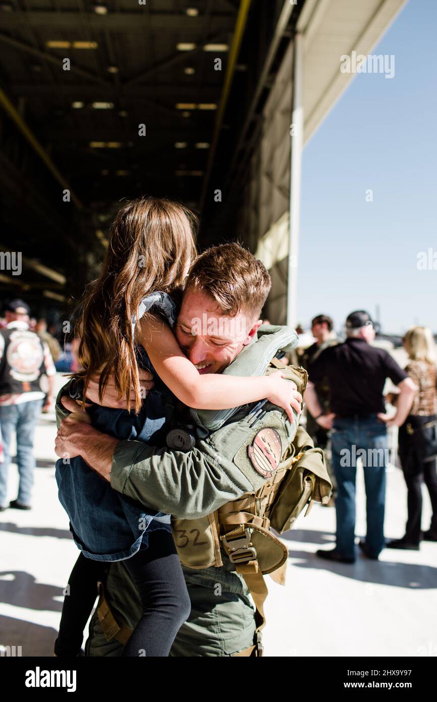 Marine Reunited & Hugging Daughter at Miramar in San Diego Stock Photo