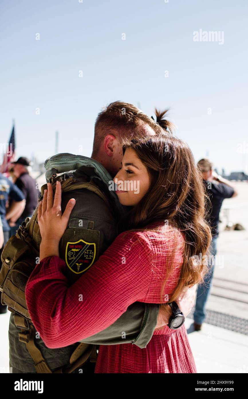 Marine Reunited & Hugging Wife at Miramar in San Diego Stock Photo