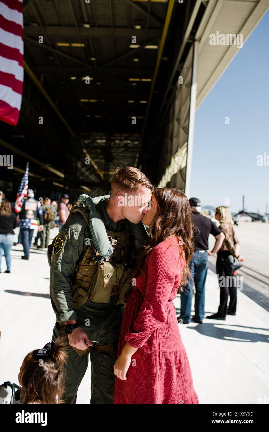 Marine Kissing Wife & Reuniting with Family in San Diego Stock Photo