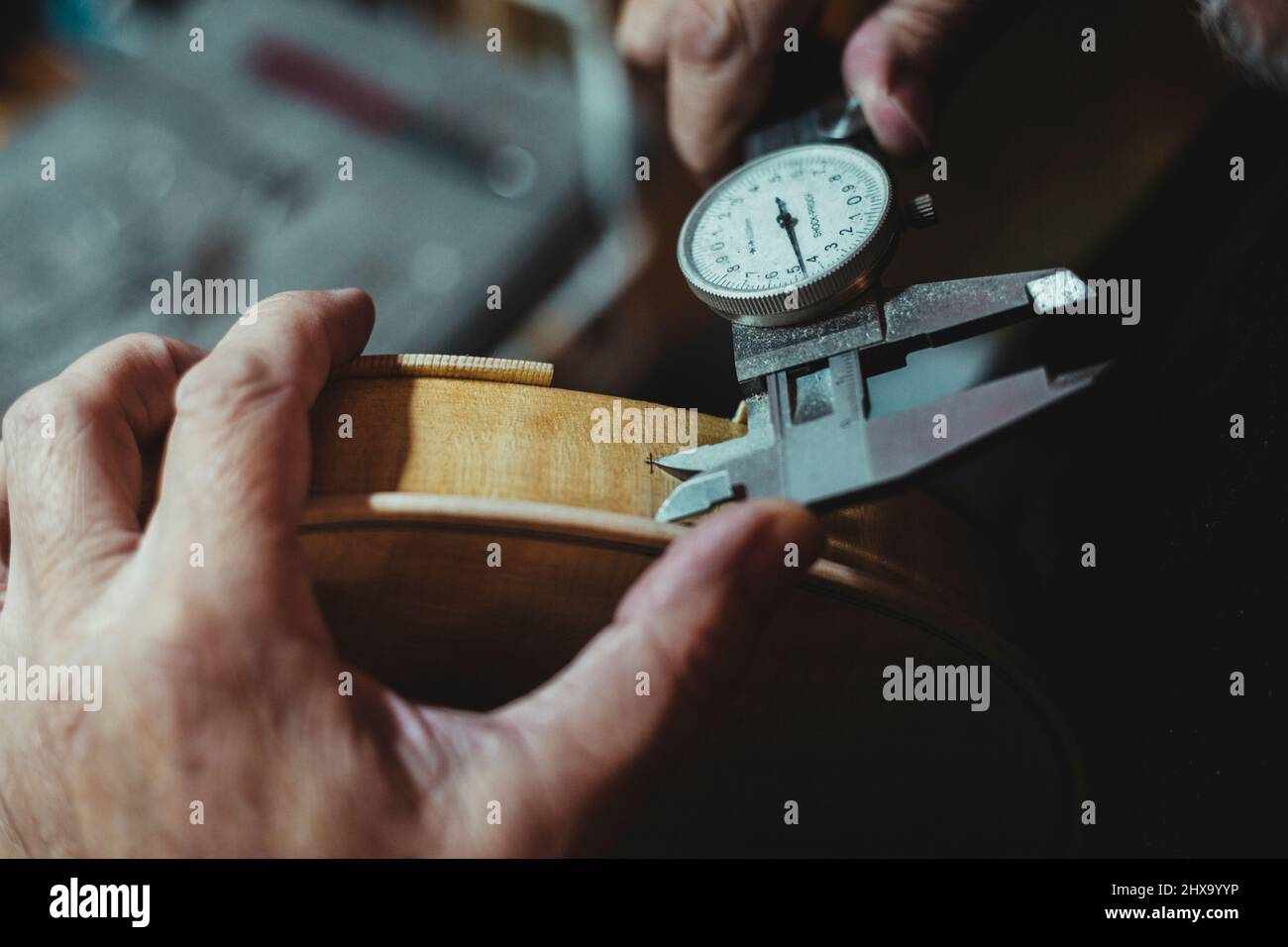Violin maker handling luthier tools for woodcarving Stock Photo Alamy