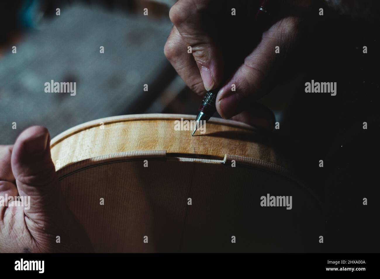 Violin maker handling luthier tools for woodcarving Stock Photo Alamy