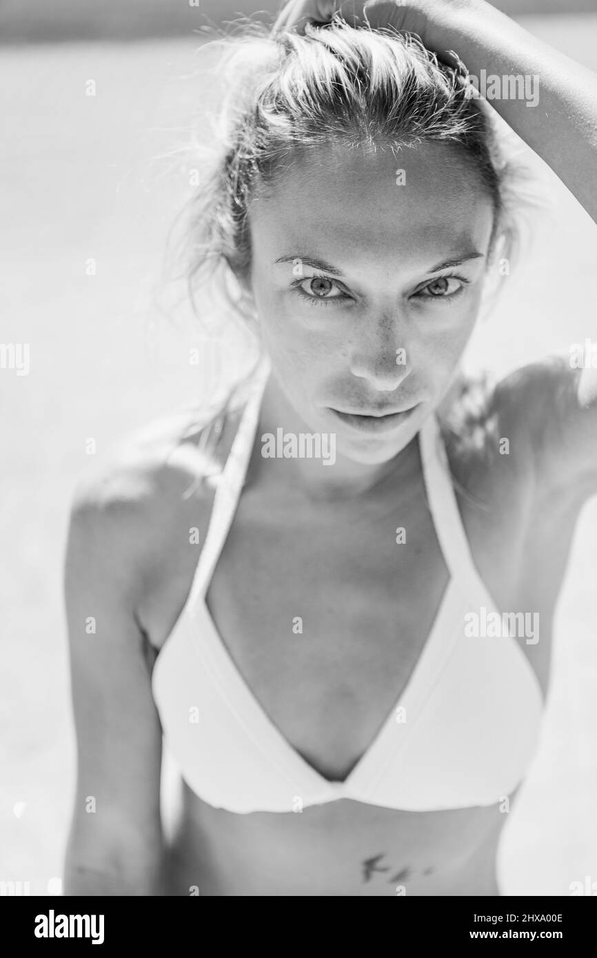 Close up portrait in black and white of a beautiful woman in a bikini Stock Photo