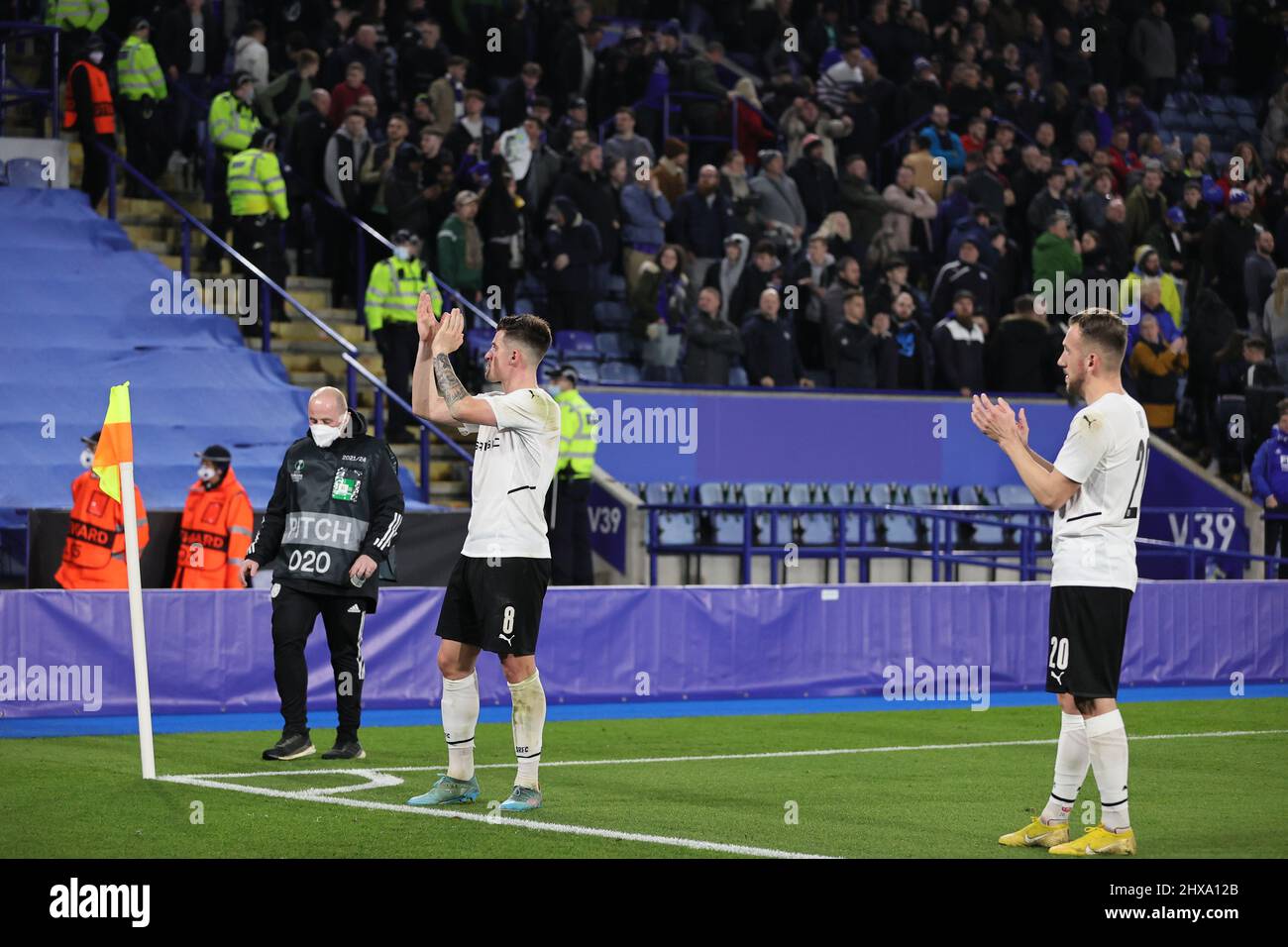 LEICESTER, UK. MARCH 10TH: Baptiste Santamaria of Rennes and Flavien Tait of Rennes applauds the travelling fans at the final whistle during the UEFA Europa Conference League Round of 16 first leg match between Leicester City and Rennes at the King Power Stadium, Leicester on Thursday 10th March 2022. (Credit: James Holyoak | MB Media) Stock Photo