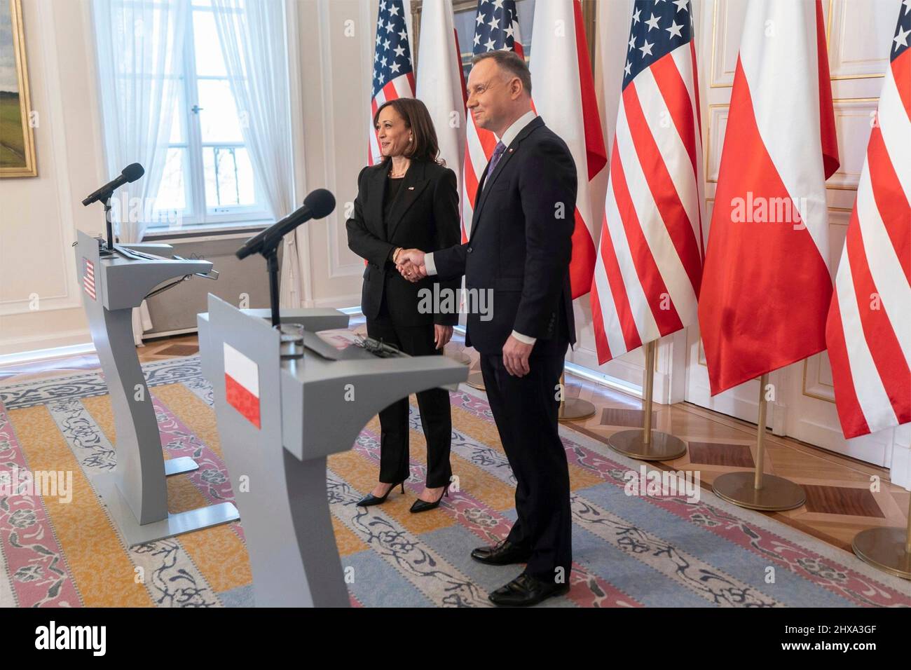 Warsaw, Poland. 10th Mar, 2022. U.S Vice President Kamala Harris, shakes hands with Polish President Andrzej Duda, right, before a joint press conference at Belwelder Palace, March 10, 2022 in Warsaw, Poland. Harris is in Poland to discuss the Ukraine crisis with NATO allies. Credit: Lawrence Jackson/White House Photo/Alamy Live News Stock Photo