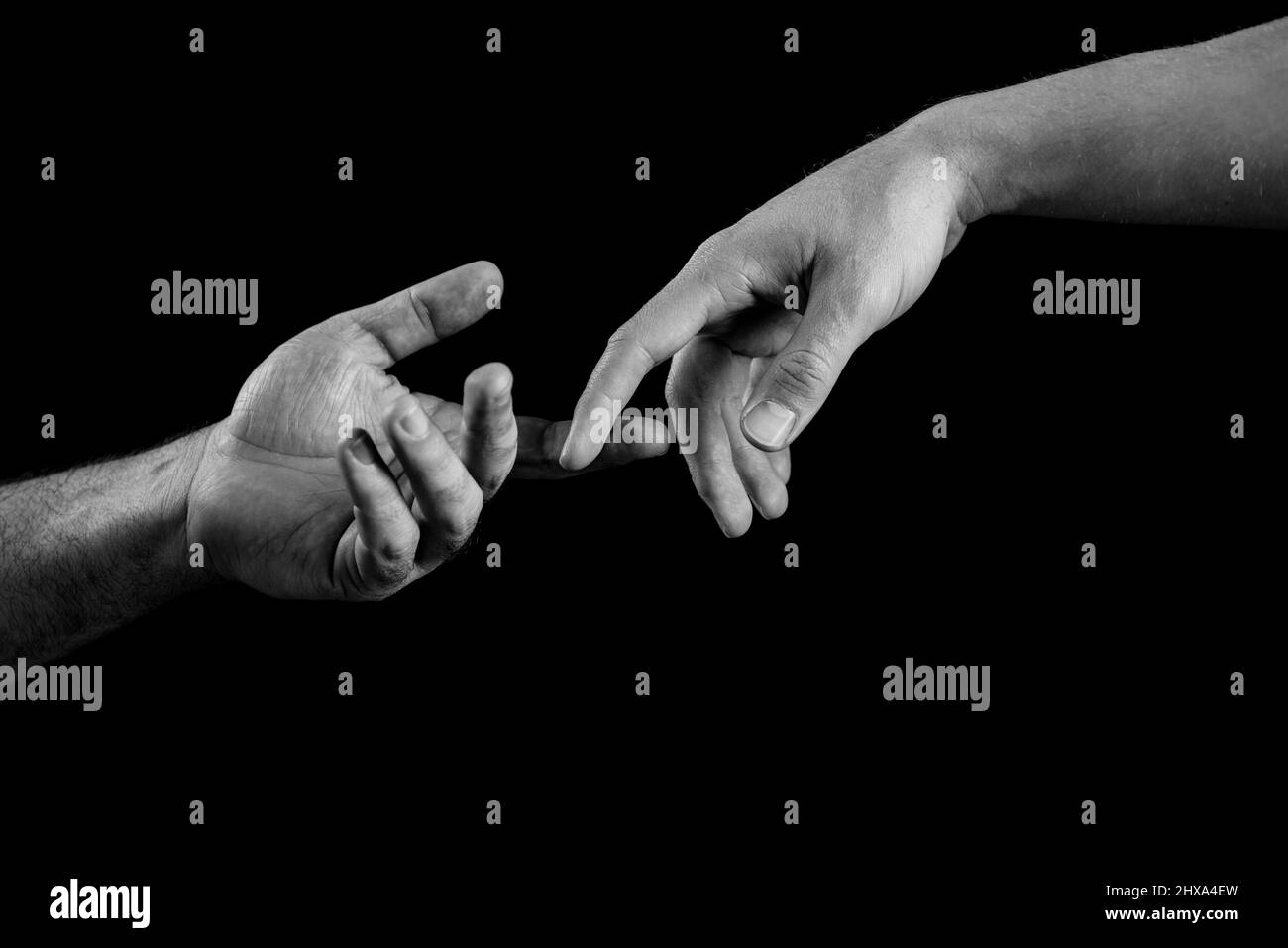 Helping hand. Giving a helping hand. Solidarity, compassion, and charity rescue. Stock Photo