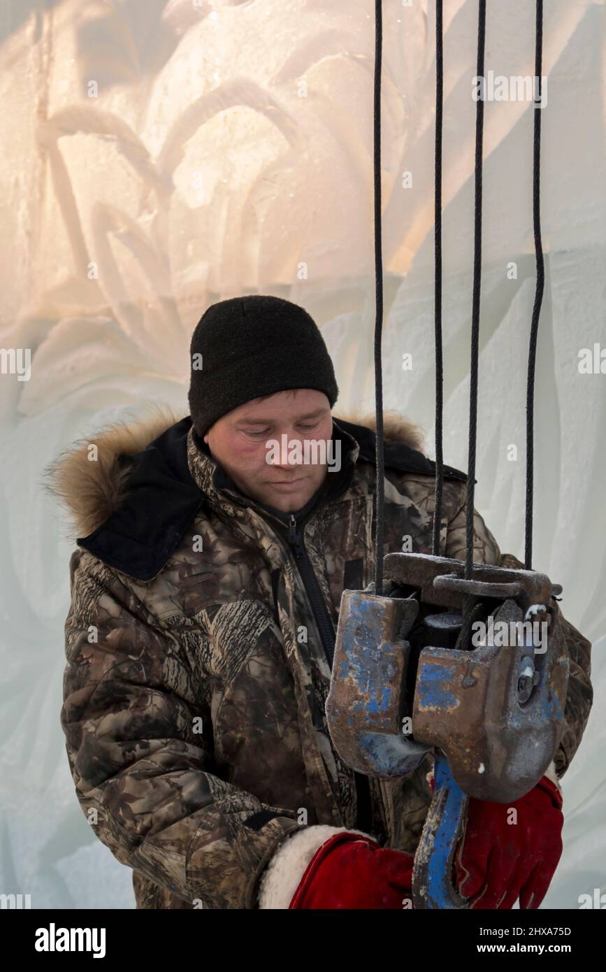 The slinger hooks the rope slings onto the hook of the truck crane Stock  Photo - Alamy