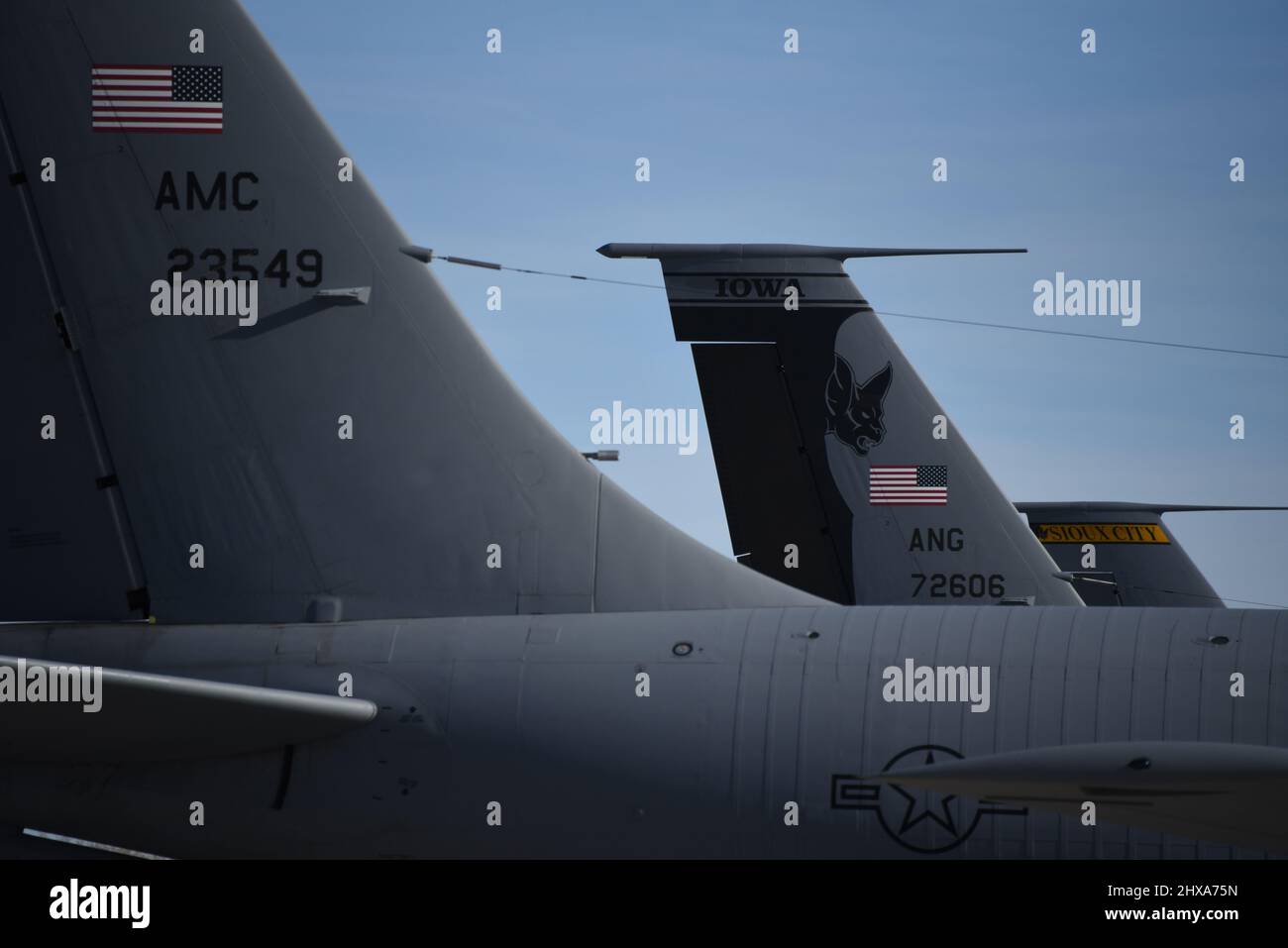 A group of U.S. Air Force KC-135 Stratotanker aircraft on the ramp at the Iowa Air National Guard in Sioux City, Iowa on March 1, 2022. Tail number 57-2606 with the bat tail flash is scheduled to be decommissioned this month. Its replacement 62-3549 in the foreground, arrived in Sioux City on March 1, 2022 from McConnell Air Force Base.     U.S. Air National Guard photo Senior Master Sgt. Vincent De Groot 185th ARW Wing PA Stock Photo