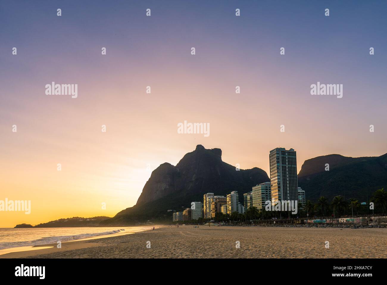 Warm Sunset at Empty Sao Conrado Beach in Rio de Janeiro With Luxury Apartment Buildings and Pedra da Gavea View Stock Photo