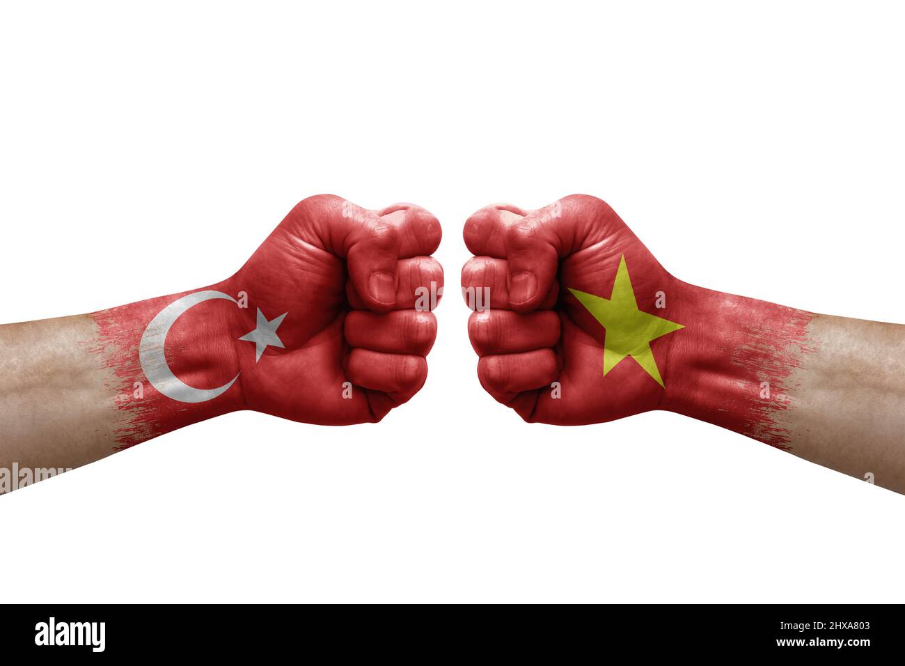 Two hands punch to each others on white background. Country flags painted fists, conflict crisis concept between turkey and vietnam Stock Photo