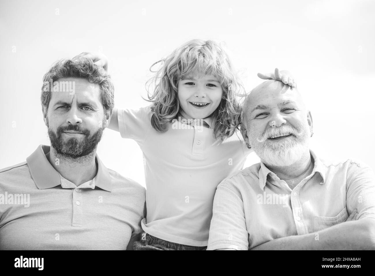 Men generation portrait of grandfather father and funny son child. Fathers day. Men in different ages. Multi generation family. Stock Photo