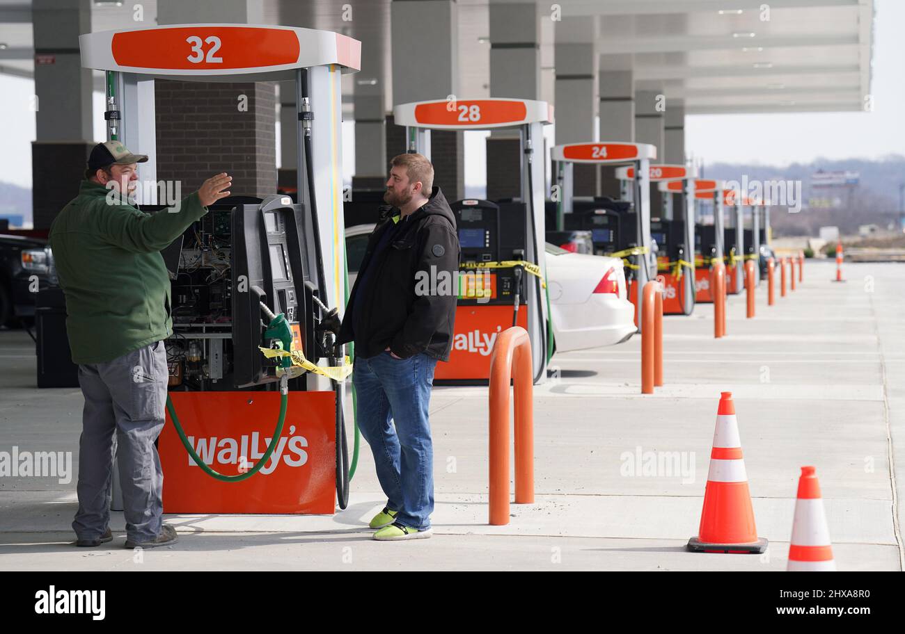 Fenton, USA. 10th Mar, 2022. Workers prepare the gas pumps for the grand opening at Wally's in Fenton, Missouri on Thursday, March 10, 2022. Wally's is a 36 thousand square foot facility, with 72 separate gas pumps spanning two football fields long. Inside the traveler is greeted by many food options plus a travel store with clothing, home items and supplies for hunting and camping. The largest store of its kind in the area will open on Friday, March 11, 2022. Photo by Bill Greenblatt/UPI Credit: UPI/Alamy Live News Stock Photo