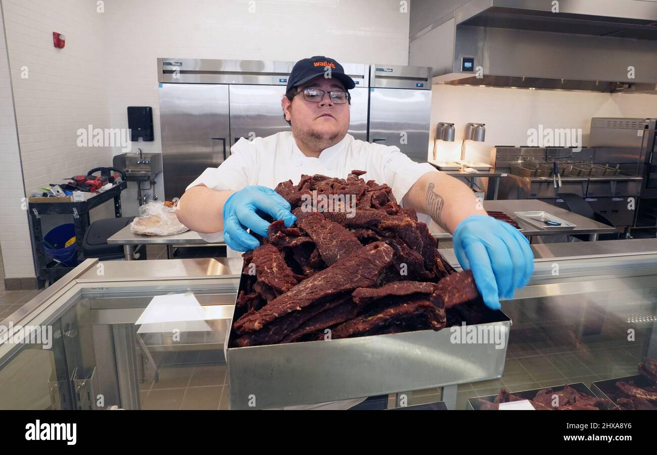 Fenton, USA. 10th Mar, 2022. Worker Scott Young prepares beef jerky for the grand opening at Wally's in Fenton, Missouri on Thursday, March 10, 2022. Wally's is a 36 thousand square foot facility, with 72 separate gas pumps spanning two football fields long. Inside, the traveler is greeted by many food options plus a travel store with clothing, home items and supplies for hunting and camping. The largest store of its kind in the area will open on Friday, March 11, 2022. Photo by Bill Greenblatt/UPI Credit: UPI/Alamy Live News Stock Photo