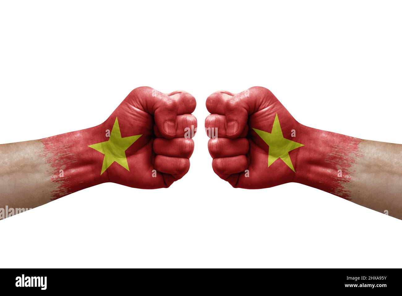 Two hands punch to each others on white background. Country flags painted fists, conflict crisis concept between vietnam and vietnam Stock Photo