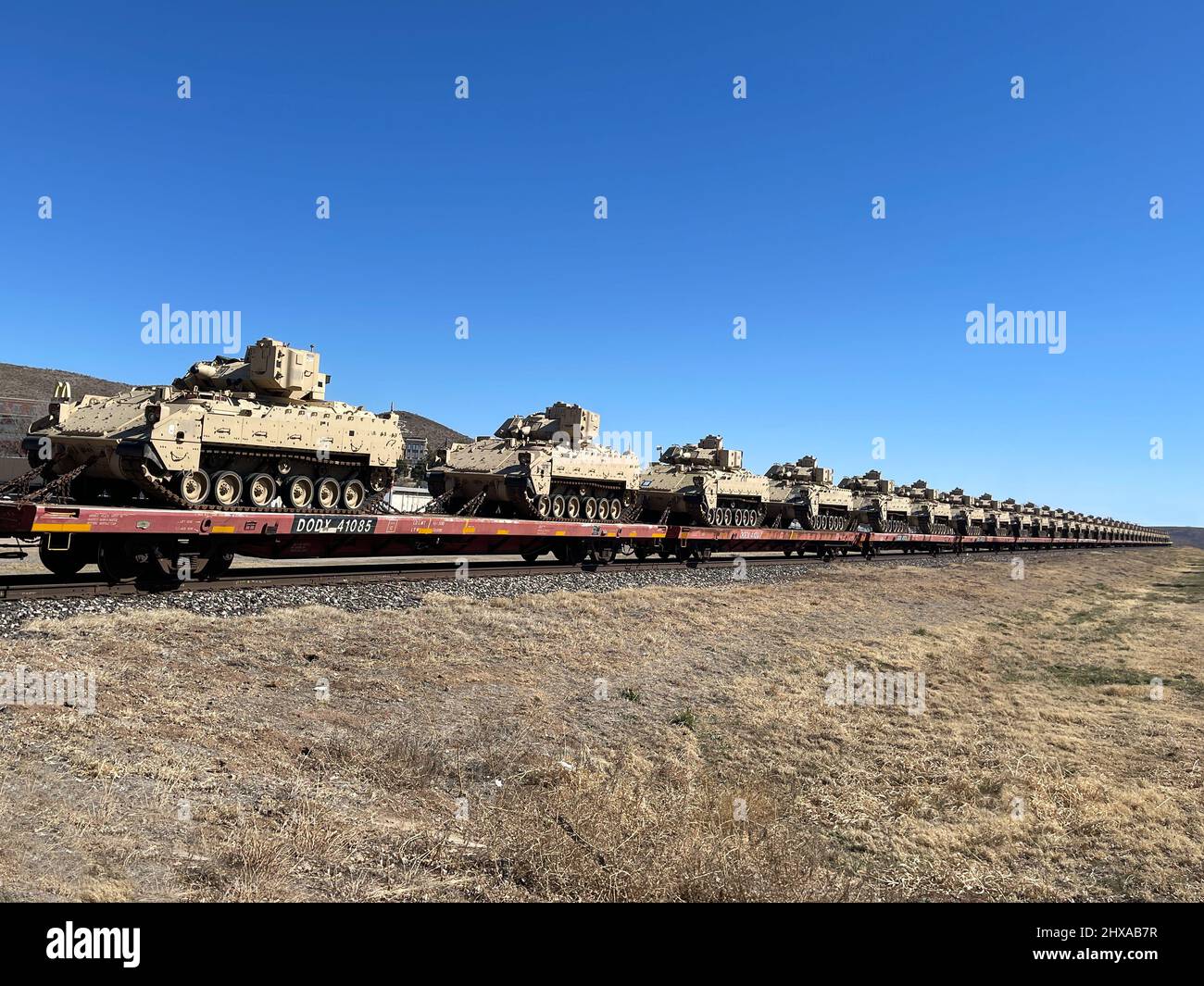 American Military tanks on a train in Texas Stock Photo Alamy