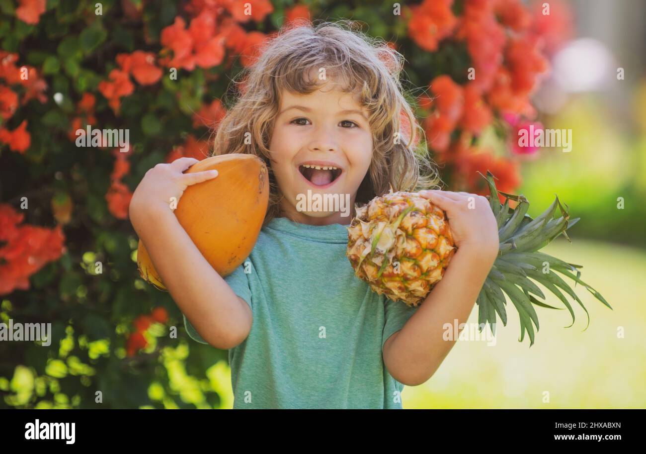 https://c8.alamy.com/comp/2HXABXN/cute-kid-with-pineapple-and-coconut-at-tropical-garden-fresh-tropical-fruits-for-kids-healthy-lifestyle-with-fresh-organic-tropical-fruits-2HXABXN.jpg